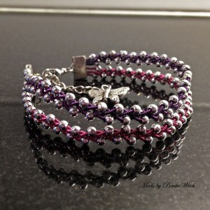 Flätat armband i tenntråd o silverpärlor